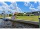 Waterfront backyard with seawall, boat lift, room for entertaining, and lush lawn at 2308 Harbour Dr, Punta Gorda, FL 33983
