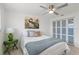 Bedroom showcasing queen bed, modern ceiling fan, closet with sliding doors, and tile flooring at 2308 Harbour Dr, Punta Gorda, FL 33983