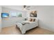 Comfortable bedroom with queen bed, modern ceiling fan, and tile flooring at 2308 Harbour Dr, Punta Gorda, FL 33983
