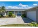 Single Gathering home with meticulously manicured yard, mature plantings and double door entry at 2308 Harbour Dr, Punta Gorda, FL 33983