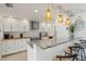 Bright kitchen with stainless steel appliances, butcher block countertops, and modern pendant lights at 2308 Harbour Dr, Punta Gorda, FL 33983