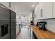 Well-lit kitchen featuring stainless steel appliances, light-colored countertops, and access to the water view at 2308 Harbour Dr, Punta Gorda, FL 33983