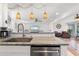 An inviting kitchen with a marble countertop island, flowing seamlessly into the adjacent living spaces at 2308 Harbour Dr, Punta Gorda, FL 33983