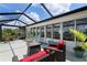 Spacious screened lanai with outdoor furniture, perfect for entertaining at 2308 Harbour Dr, Punta Gorda, FL 33983
