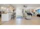 Spacious living area with an open floor plan, bar seating, and neutral tones offering modern comfort at 2308 Harbour Dr, Punta Gorda, FL 33983