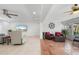 Open-concept living area featuring tile flooring, modern furnishings, and abundant natural light from the sunroom at 2308 Harbour Dr, Punta Gorda, FL 33983