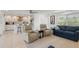 Bright living space with modern seating, adjacent to a stylish, well-equipped kitchen at 2308 Harbour Dr, Punta Gorda, FL 33983