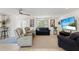 Bright living room with a ceiling fan, tile flooring, comfortable seating and water view displayed on television at 2308 Harbour Dr, Punta Gorda, FL 33983