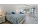 Bright main bedroom featuring a queen bed, TV, and lovely views of the water at 2308 Harbour Dr, Punta Gorda, FL 33983