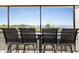 Relax and enjoy water views from this screened balcony with comfortable seating at 25188 Marion Ave # E409, Punta Gorda, FL 33950