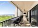 Relax on this spacious balcony with water views, counter seating, and a ceiling fan at 25188 Marion Ave # E409, Punta Gorda, FL 33950