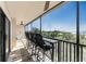 Enjoy relaxing on this screened balcony with ceiling fan, counter seating, and scenic views at 25188 Marion Ave # E409, Punta Gorda, FL 33950