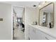 Elegant bathroom with white cabinets, long countertop and storage at 25188 Marion Ave # E409, Punta Gorda, FL 33950