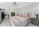 Comfortable bedroom offers stylish dressers and balcony access at 25188 Marion Ave # E409, Punta Gorda, FL 33950