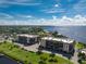 Aerial view of waterfront condos with lush landscaping and boat docks at 25188 Marion Ave # E409, Punta Gorda, FL 33950