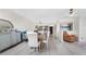 Open concept dining area showcasing the kitchen and stylish decor at 25188 Marion Ave # E409, Punta Gorda, FL 33950