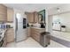 Well-equipped kitchen with stainless steel appliances and a functional layout at 25188 Marion Ave # E409, Punta Gorda, FL 33950