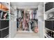 Custom walk-in closet with rods, shelves, and drawers for clothing and accessories at 25188 Marion Ave # E409, Punta Gorda, FL 33950