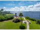 Scenic waterfront community park featuring a gazebo, picnic tables, and beautiful water views on a sunny day at 25188 Marion Ave # E409, Punta Gorda, FL 33950