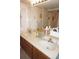 Bathroom vanity with dual sinks, cabinet storage, and ample counter space at 25188 Marion Ave # F106, Punta Gorda, FL 33950