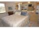 Comfortable bedroom with large windows and a work space for reading and drawing at 25188 Marion Ave # F106, Punta Gorda, FL 33950