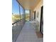 Relaxing screened patio with table and chairs overlooking beautiful landscaping and waterfront views at 25188 Marion Ave # F106, Punta Gorda, FL 33950