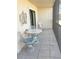 Enclosed balcony with charming seating provides a peaceful outdoor retreat at 25188 Marion Ave # F106, Punta Gorda, FL 33950