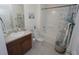 Full bathroom featuring a vanity, shower-tub combo with a decorative shower curtain, and a toilet at 25325 E Lenox Cir, Punta Gorda, FL 33950