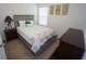 Bedroom features neutral walls, carpet flooring, and coastal-themed decor at 25325 E Lenox Cir, Punta Gorda, FL 33950