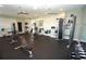Community fitness center with modern weight machines, free weights, and floor to ceiling mirrors to meet your fitness goals at 25325 E Lenox Cir, Punta Gorda, FL 33950