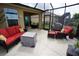 Screened patio with elegant outdoor furniture and a tranquil atmosphere, perfect for relaxation at 25325 E Lenox Cir, Punta Gorda, FL 33950