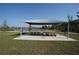 Enjoy outdoor dining at the picnic area, complete with a shaded canopy and picturesque views at 25325 E Lenox Cir, Punta Gorda, FL 33950