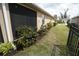 Lush backyard with flower beds and a privacy fence, offers serenity and privacy at 25325 E Lenox Cir, Punta Gorda, FL 33950