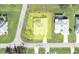 Aerial view of the property highlighting lot dimensions, backyard pool, landscaping, and street access at 25472 Tevesine Ct, Punta Gorda, FL 33983