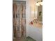 Bathroom featuring a patterned shower curtain, mirrored cabinet, and vanity at 25472 Tevesine Ct, Punta Gorda, FL 33983