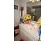 Bathroom vanity with framed art, yellow daffodils, and decorative accents at 25472 Tevesine Ct, Punta Gorda, FL 33983