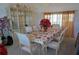 Dining room showcasing an elegant dining table and display cabinet at 25472 Tevesine Ct, Punta Gorda, FL 33983