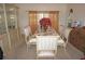 Dining area featuring a large dining table with seating for six next to china cabinet at 25472 Tevesine Ct, Punta Gorda, FL 33983