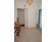 Bright entryway with tile floors, chandelier and arched opening to other rooms at 25472 Tevesine Ct, Punta Gorda, FL 33983