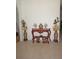 Foyer featuring an ornate console table with decorative vases, figurines, and potted plants at 25472 Tevesine Ct, Punta Gorda, FL 33983