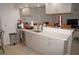 Updated kitchen boasts modern stainless steel appliances, sleek gray cabinets, and a spacious countertop perfect for meal preparation at 25472 Tevesine Ct, Punta Gorda, FL 33983