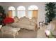 Living area featuring elegant furniture, arched windows, and decorative accents at 25472 Tevesine Ct, Punta Gorda, FL 33983