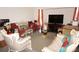 Spacious living room with couches, television, and large window at 25472 Tevesine Ct, Punta Gorda, FL 33983