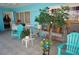 Spacious patio with blue walls, tile flooring, and comfortable seating at 25472 Tevesine Ct, Punta Gorda, FL 33983