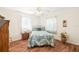 Comfortable bedroom with ample natural light and hardwood floors, offering a serene space at 25730 Deep Creek Blvd, Punta Gorda, FL 33983