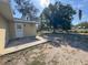 Backyard with a large tree and a patio at 30147 Holly Rd, Punta Gorda, FL 33982