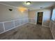 Cozy bedroom with carpet, decorative wall trim, and a bright window view at 30147 Holly Rd, Punta Gorda, FL 33982