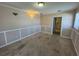 Cozy bedroom with wainscoting and carpeted floors at 30147 Holly Rd, Punta Gorda, FL 33982