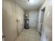 Utility room featuring a water heater and access to the outside at 30147 Holly Rd, Punta Gorda, FL 33982