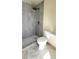Modern bathroom featuring a walk-in shower with sleek fixtures and contemporary tiling at 3372 Elkcam Blvd, Port Charlotte, FL 33952
